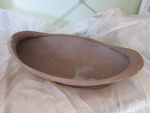 an unfired oval serving dish